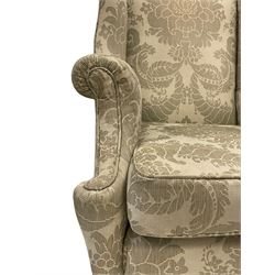 Late 19th century mahogany Queen Anne design wingback armchair, upholstered in pale sage fabric with foliate design with seat cushion and sprung seat, on cabriole feet joined by turned stretchers