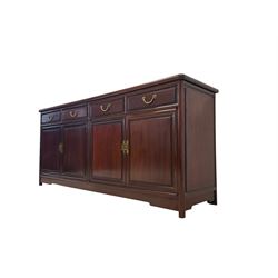 Oriental hardwood sideboard, rectangular top with rounded edges, fitted with four drawers with gilt metal handles and moulded fronts, over four panelled cupboards