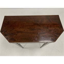 George III Sheraton style mahogany and boxwood strung tea table, the rectangular fold over top with canted corners over urn acorn and harebell inlays, raised on square tapered supports, W90cm
