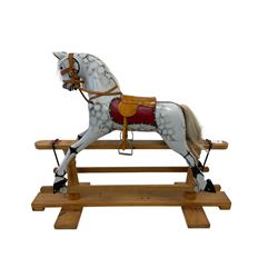 20th century dappled grey rocking horse, carved and painted with leather saddle and tack, real horsehair mane, tail and forelock, raised on a pine trestle base