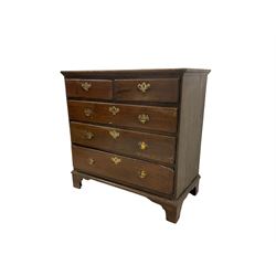 George III oak straight-front chest, fitted with two short and three long graduating drawers with moulded fronts and brass handle pulls, raised on bracket feet