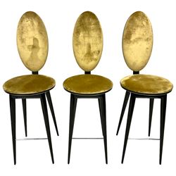 Andree Putman for Reflex Angelo - set three bar stools, the oval back and circular swivel seat upholstered in gold fabric with black piping, raised on tapering ebonised supports