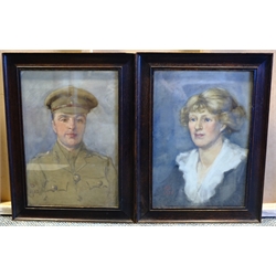 English School (Early 20th century): Portrait of a WWI Soldier and his Wife, pair watercolours signed with monogram VO? and dated 1915, 39cm x 26cm (2)