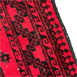 Persian Bokhara red ground runner, the field decorated with eight Gul motifs, geometric design border and guard stripes