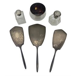 Art Nouveau design silver backed hand mirror and matching brush Birmingham 1959, another brush, glass dressing table jar with silver and tortoiseshell cover, globe scent flask with silver cover and one other jar (6)