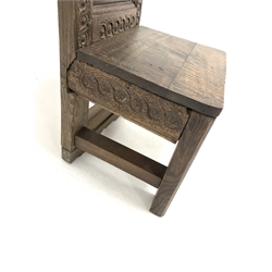 Carved oak Wainscot style chair, with scrolled cresting rail over floral roundels, panelled seat, raised on square chamfered supports, W47cm