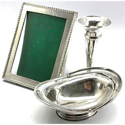 Late Victorian oval silver sugar bowl with swing handle on pedestal foot, Sheffield 1895 Maker Atkin Bros., 5oz, silver bead edge photograph frame 17cm x 13cm and a small silver trumpet shape vase H14cm