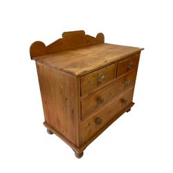 Pine chest of drawers, the raised back over two short and two long drawers, raised on turned supports 