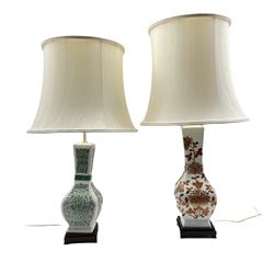 Two Chinese style porcelain table lamps, each of square section form with green and iron red floral decoration, on hardwood bases with shades H88cm max (overall) (2)