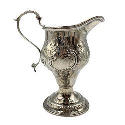George III silver baluster cream jug with scroll handle and later embossed decoration, marks rubbed