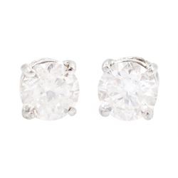 Pair of 18ct white gold round brilliant cut diamond stud earrings, total diamond weight 1.01 carat, with World Gemological Institute report
