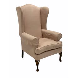 20th century walnut framed wingback armchair, upholstered in pink fabric with squab cushion, raised on cabriole front supports W82cm