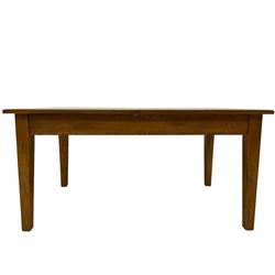 Oak dining table, the sectional plank top, raised on square tapering supports 