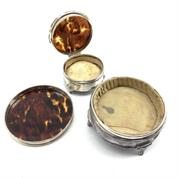 Silver circular dressing table box with pull off tortoiseshell cover and silver pique decoration D8.5cm Birmingham 1931, a similar smaller box with hinged cover and a 19th century continental silver oval box and cover with embossed decoration, import marks Chester 1899 (3)