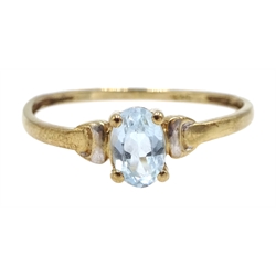 Gold single stone blue topaz ring, stamped 9ct