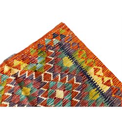 Chobi Kilim amber ground rug, the field decorated with two rows of multi-coloured lozenges, guarded border with repeating geometric design