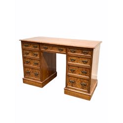 Late Victorian pitch pine twin pedestal desk, the rectangular top with moulded edge over one long and two banks of five graduated drawers, with skirted base W121cm, H78cm, D56cm