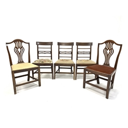 Set of three George III mahogany dining chairs, geometric carved crest rail over reeded rails and uprights, needlework upholstered drop in seat pads, raised on square tapered supports (W51cm) together with a pair of mid 19th century elm country dining chairs with pierced splats and drop in upholstered seat pads