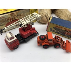 Dinky Toys diecast model Jones Fleetmaster Cantilever Crane 970 & Dinky Hatra Tractor Shovel, in original boxes and a vintage teddy bear with with golden mohair, glass eyes, pronounced muzzle, brown stitched nose, mouth and claws, swivel head, jointed limbs and  growler (3)