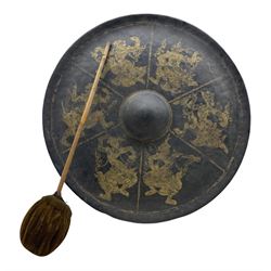 Burmese black lacquered metal gong decorated with six gilt figures, D62cm with beater 
