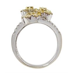 Large white gold diamond ring, six yellow diamond offset clusters, with three split white diamond set shoulders, stamped 18K