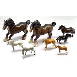 Two Beswick cantering Shire horses in brown gloss No. 975, Beswick Shetland pony No. 1648,  a Shetland foal No. 1034, two Palomino foals and two grey foals (8)