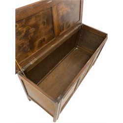 20th century oak blanket box, the hinged lifting lid over three panelled base, raised on squared supports with castors; and a child’s chair