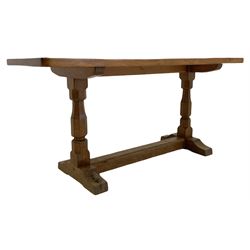 'Beaverman' oak coffee table, rectangular adzed top on twin octagonal pillar supports, sledge feet connected by floor stretcher, carved with beaver signature, by Colin Almack of Sutton-under-Whitestonecliffe