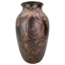John Egerton (c1945 - ) - Sgraffito vase decorated with grapes, peahens etc in shades of brown and green signed with initials and '96' H36cm