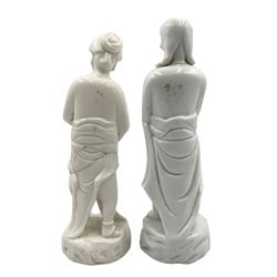 Matched pair of Qing dynasty 18th century Chinese Blanc de Chine porcelain 'Adam and Eve' figures, each figure partially draped in robes, on rocky plinths, H23.5cm