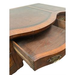 Queen Anne style serpentine walnut writing table, the leather inset top over one long and four short drawers, raised on cabriole supports with acanthus leaf carvings