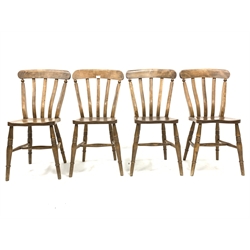 Set of four country elm and beech dining chairs, with shaped seats raised on ring turned supports and stretchers