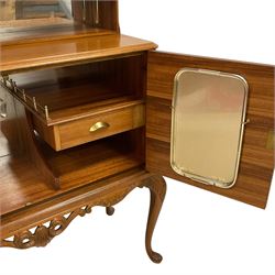Mid-to-late 20th century figured walnut cocktail cabinet, raised upper section enclosed by hinged door, double cupboard below, the interior fitted with drawer and shelf, on acanthus carved cabriole supports 