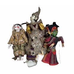 Three vintage Burmese puppets, two having sequin and mirrored decoration 