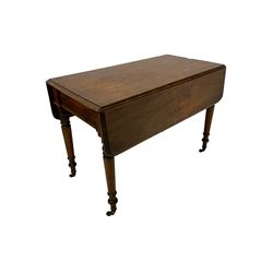 19th century mahogany drop-leaf table, rectangular top with rounded corners fitted with single drawer, raised on turned supports with brass castors