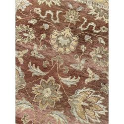 Persian design beige ground rug, Zeigler style with stylised plant decoration, pale ground border decorated with flower heads