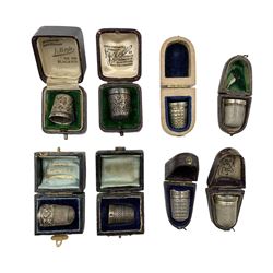 Eight cased silver thimbles, including one in Mauchline ware case etc, all hallmarked