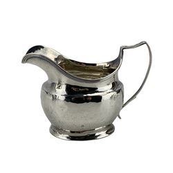 George III silver cream jug with reeded edge and angular handle, engraved with initials London 1815 Maker Abraham Peterson