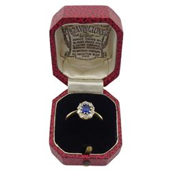 Gold oval synthetic sapphire and diamond cluster ring, stamped 18ct