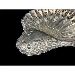Late Victorian silver shell shape dish, the pierced border with flower heads and leaves, the flattened handle engravd with initials and on fluted ball feet 25cm x 20cm Sheffield 1895 Maker Atkin Bros. 6.8oz