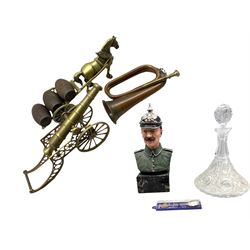 'Premier' copper and brass bugle, brass cannon and carriage, brass horse and cart with three wooden barrels, Composite bust of a German military figure wearing a  Pickelhaube by M.E. Grayson, glass decanter and souvenir spoon 