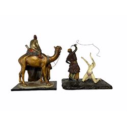 After Bergmann - Spelter table lighter in the form of a carpet seller with camel and rider H19cm and one other Bergmann style figure