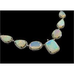 Silver pear, oval and octagonal cut opal and round brilliant cut diamond necklace, with diamond set clasp, with a pair of oval cut opal and diamond pendant stud earrings, total opal weight approx 79.50 carat, total diamond weight approx 6.70 carat