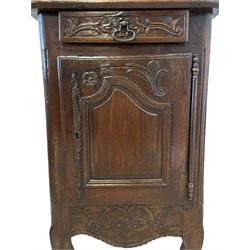 18th century French oak cupboard, the projecting cornice over floral carved frieze, enclosed by two shaped panelled doors and fitted with drawer, on scroll carved cabriole supports, W72cm, H174cm, D49cm
