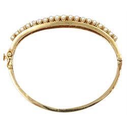 14ct gold pearl and sapphire hinged bangle, stamped 14K
