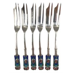 Set of six Art Nouveau silver and enamel pastry forks designed by Archibald Knox for Liberty & Co., each with stylized turquoise and blue shaded terminals, hallmarked Liberty & Co., Birmingham 1925, in original fitted presentation case