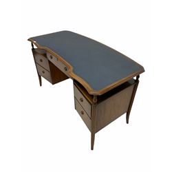 Mid 20th century mahogany serpentine front desk by 'Strongbow furniture', inset blue tooled skiver writing surface over five drawers, raised on splayed supports W137cm