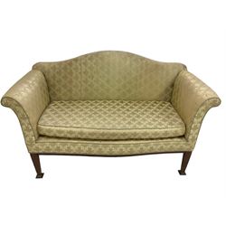 Edwardian mahogany framed two seat settee, humpback over rolled arms and serpentine front with sprung seat, upholstered in foliate patterned sage green damask with loose seat cushion, on tapering supports
Provenance: From the Estate of the late Dowager Lady St Oswald
