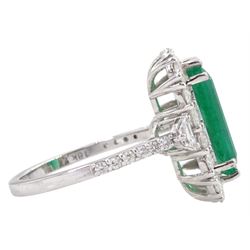 18ct white gold emerald and round brilliant cut diamond cluster ring, stamped 18K, emerald approx 3.70 carat, total diamond weight approx 1.20 carat
