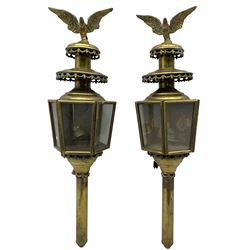 Pair of brass carriage lanterns of hexagonal design with glazed panels and spread eagle finials, converted to electricity H75cm